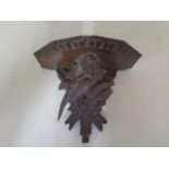 A Victorian carved Black Forest wall bracket featuring a pair of pheasants, 23cm wide x 19cm deep,