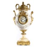 A late 19th century French porcelain and ormolu mounted mantel clock, the eight day brass drum