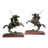 A pair of 19th century French bronze equestrian groups, of warriors with spears, each rearing on a