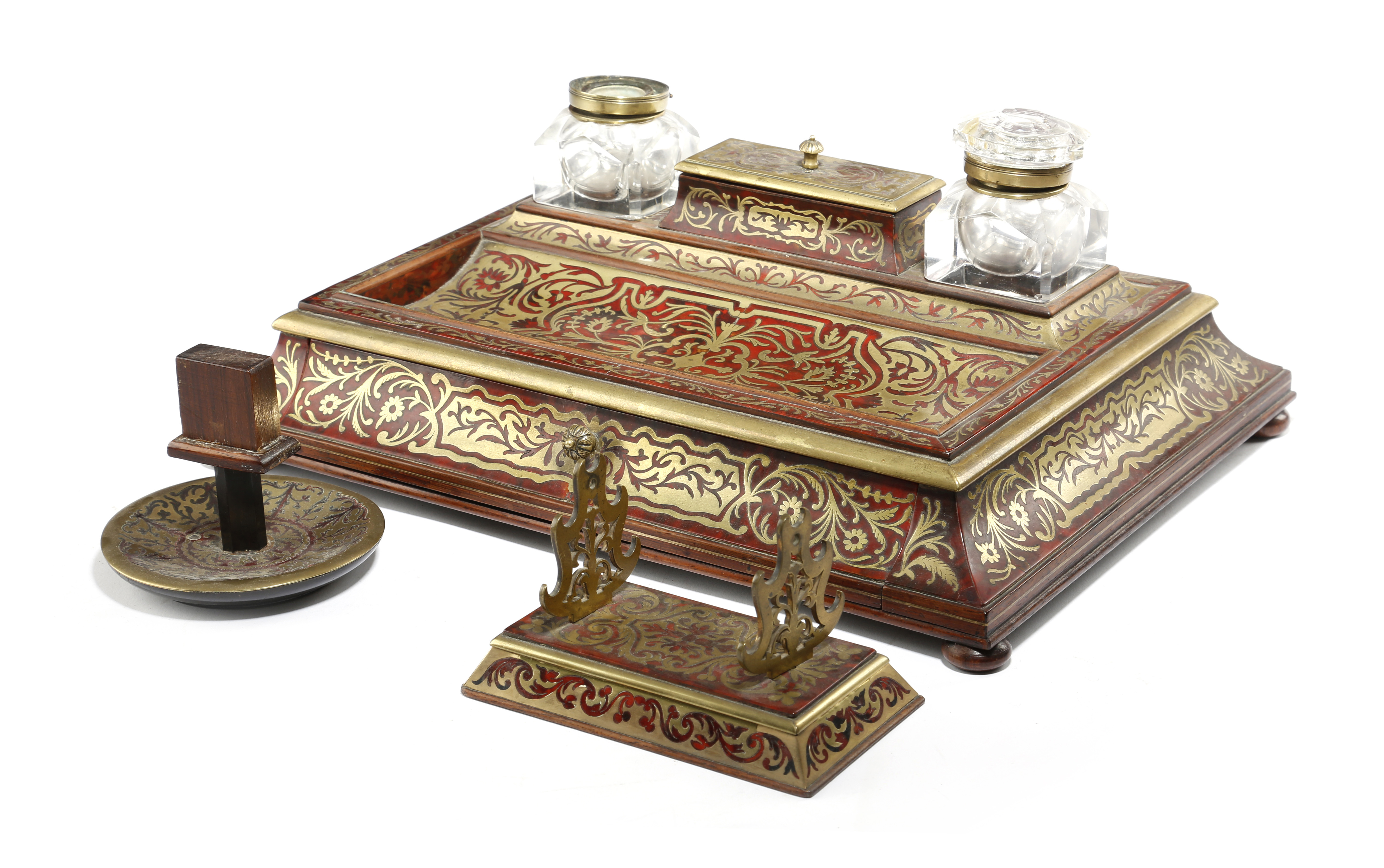 λ A Victorian boulle inkstand in the manner of Asprey, with foliate designs of cut-brass on a