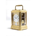 A small late 19th century gilt brass petite sonnerie carriage clock, the eight day movement with a