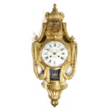 A French Louis XVI ormolu cartel clock, with a later eight day brass drum movement striking on a