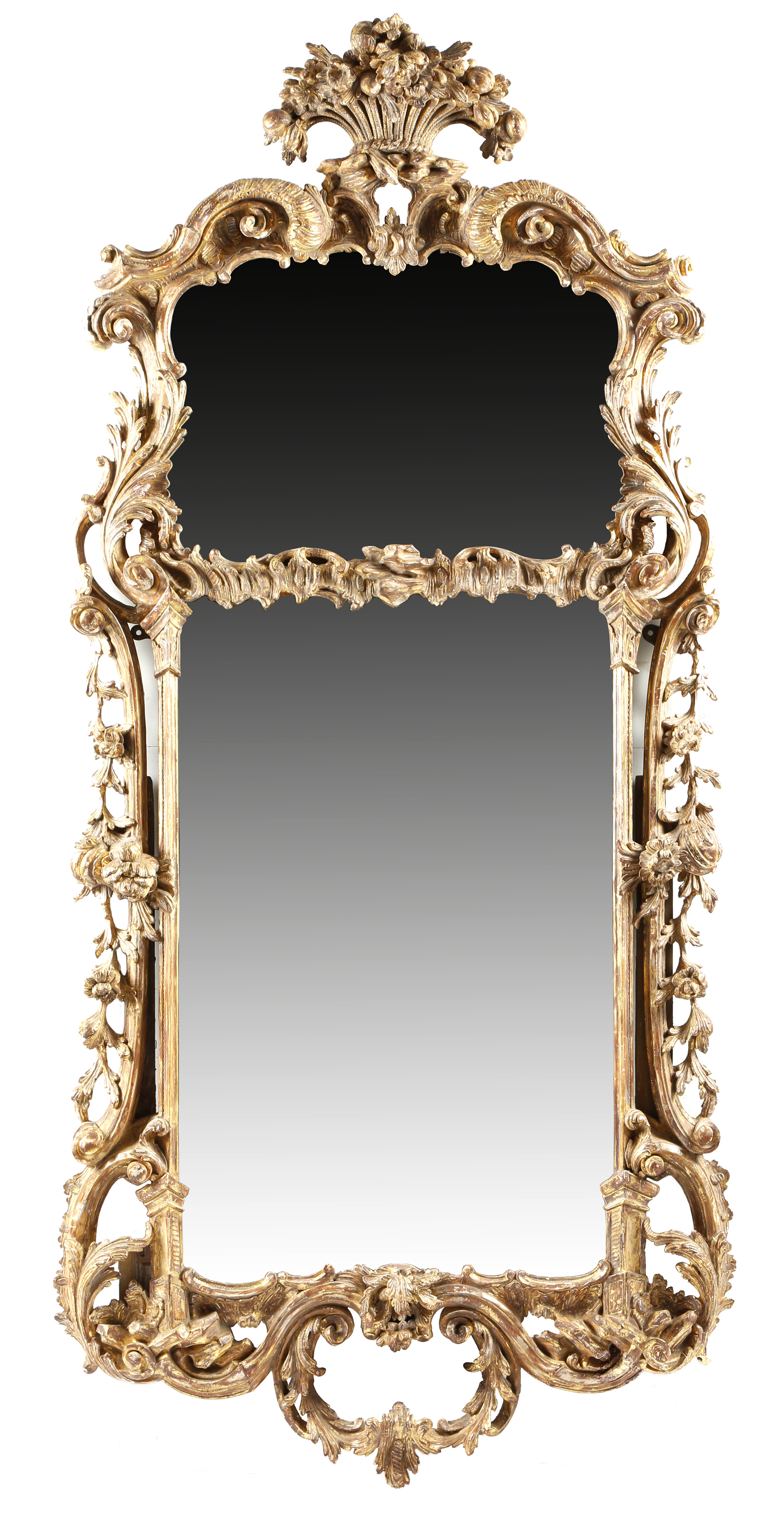 A George III giltwood wall mirror in the manner of John Linnell, with two shaped plates divided by a