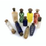 A collection of ten 19th century silver-mounted glass scent bottles, comprising: one with green