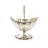 A George III silver swing-handled sugar basket, by Peter and Jonathan Bateman, London 1790, lobed