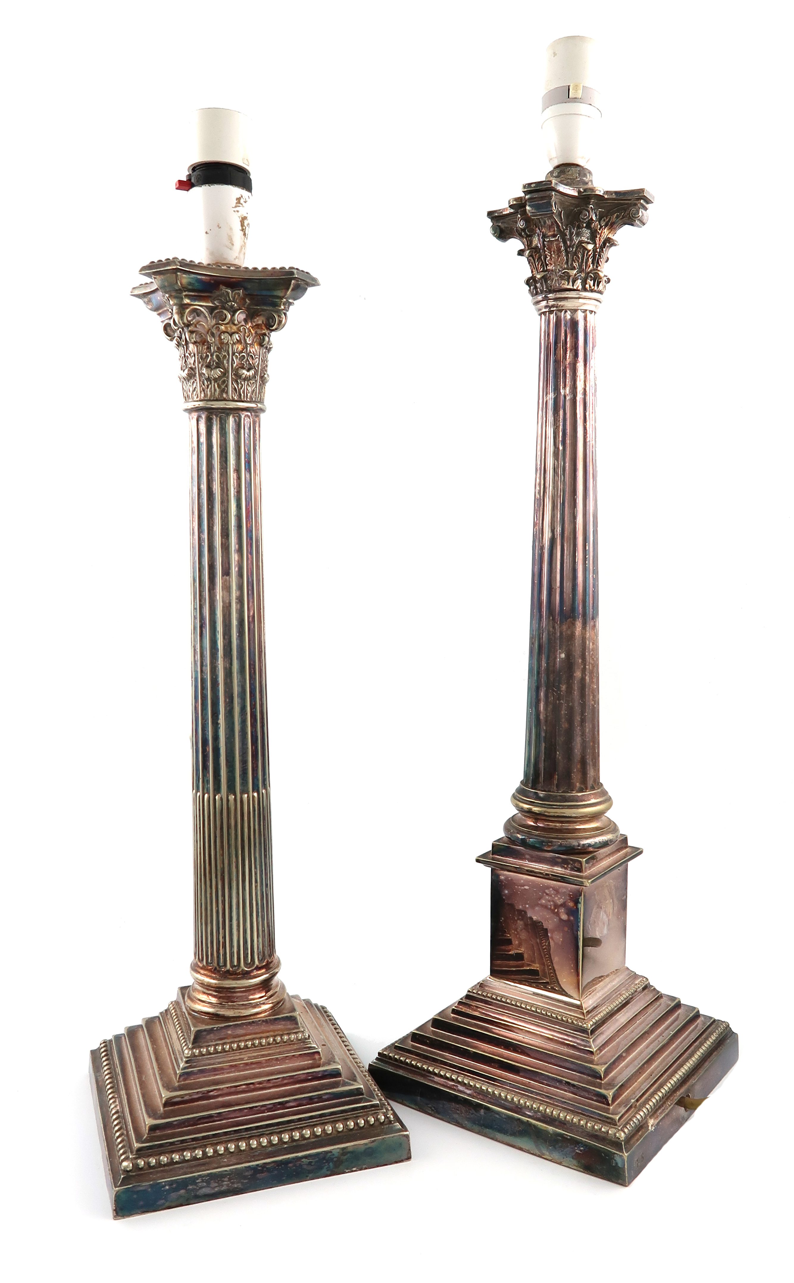 Two electroplated table lamps, Corinthian column form, fluted stems, on stepped square bases with