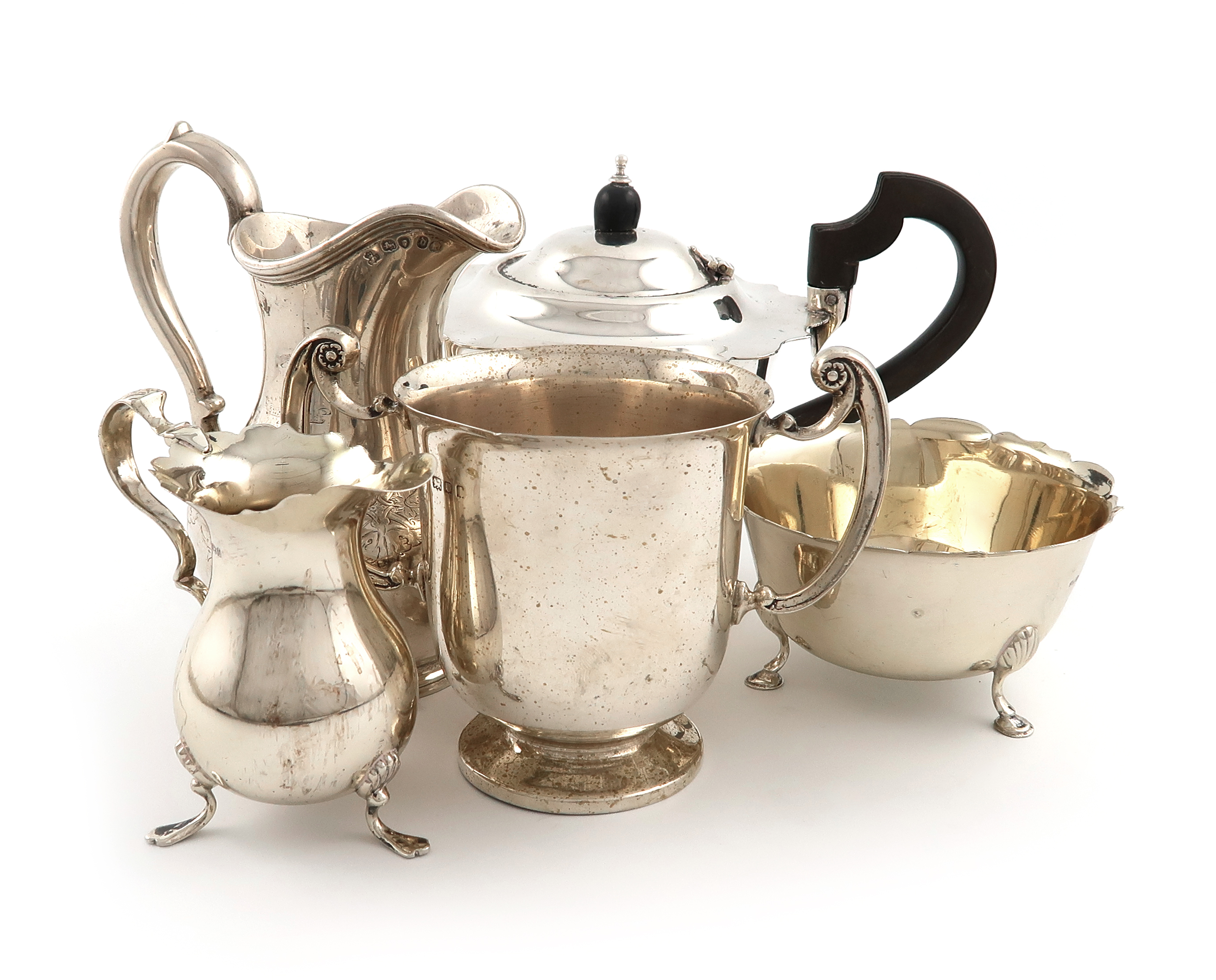 A mixed lot of silver items, various dates and makers, comprising: a matched three-piece tea set,