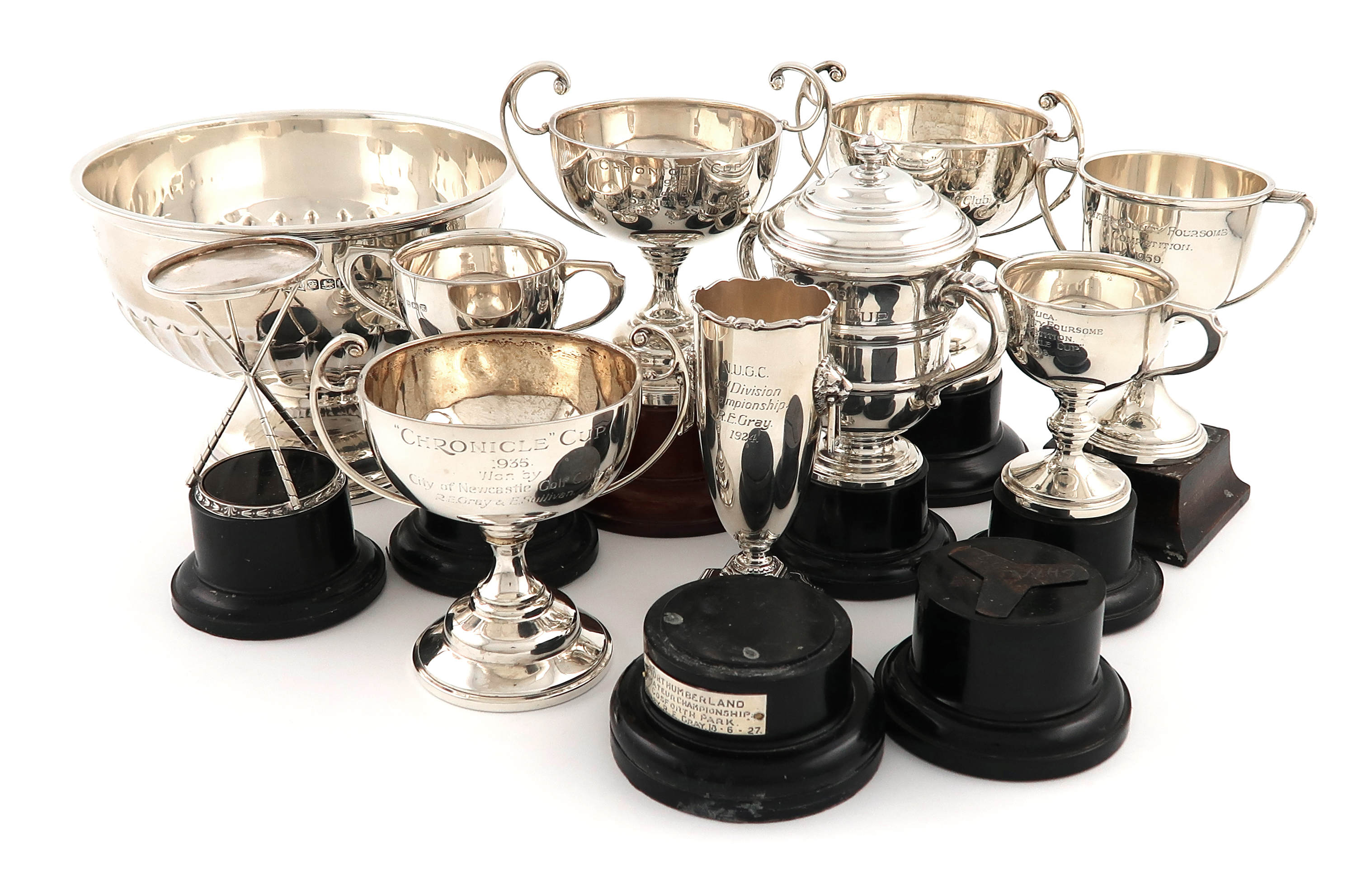 A small collection of silver golf trophies, comprising: one modelled as three golf tees,