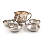 A small collection of Arts and Crafts silver, comprising: a tyg, by Elkington and Co., London