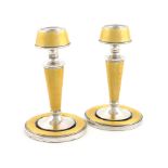 A pair of silver and yellow enamel candlesticks, by A L Davenport Ltd, Birmingham 1931, tapering