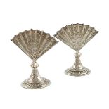 A matched pair of Victorian silver menu card holders, one with import marks for London 1894,