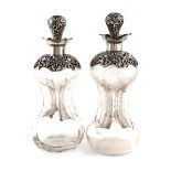 A similar pair of Edwardian silver-mounted glass decanters, by Matthew John Jessop, Birmingham 1901,