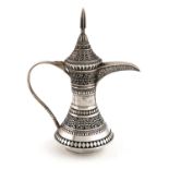 An Oman silver coffee jug, retailed by Jawahir, Oman, tapering circular form, chased decoration,