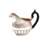 A 19th century Russian silver cream jug, marked E.F and A.H, St. Petersburg, oval form, part-