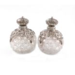 A pair of Victorian silver-mounted cut-glass scent bottles, by J. Rosenthal, London 1892, globular