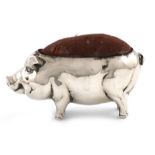 A novelty silver pig pin cushion, by H. Matthews, Chester 1910, modelled in a standing position, 7.