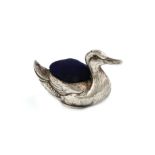 An Edwardian novelty silver duck pin cushion, by Crisford and Norris, Birmingham 1922, modelled in a