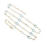 An aquamarine and moonstone long chain, set with faceted aquamarines and moonstone cabochons in