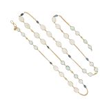 An aquamarine, moonstone, sapphire and diamond long chain, set with pairs of aquamarines and