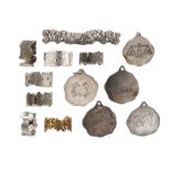 A quantity of silver rings and pendants, the various pendants and rings with zodiac motifs, together