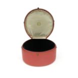 A pink leather tiara case by Cartier, with velvet lining, 22 x 22 x 11cm (outer dimensions)