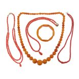 λ A single-row amber bead necklace, the spherical beads graduate from 7 - 21mm, 61cm long, 47g,