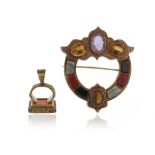 A Scottish gold gem-set brooch, the Celtic design set with carved banded agates, and faceted