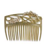 λ An Art Nouveau tortoiseshell comb, in the style of Louis Aucoc, the pierced foliate upper