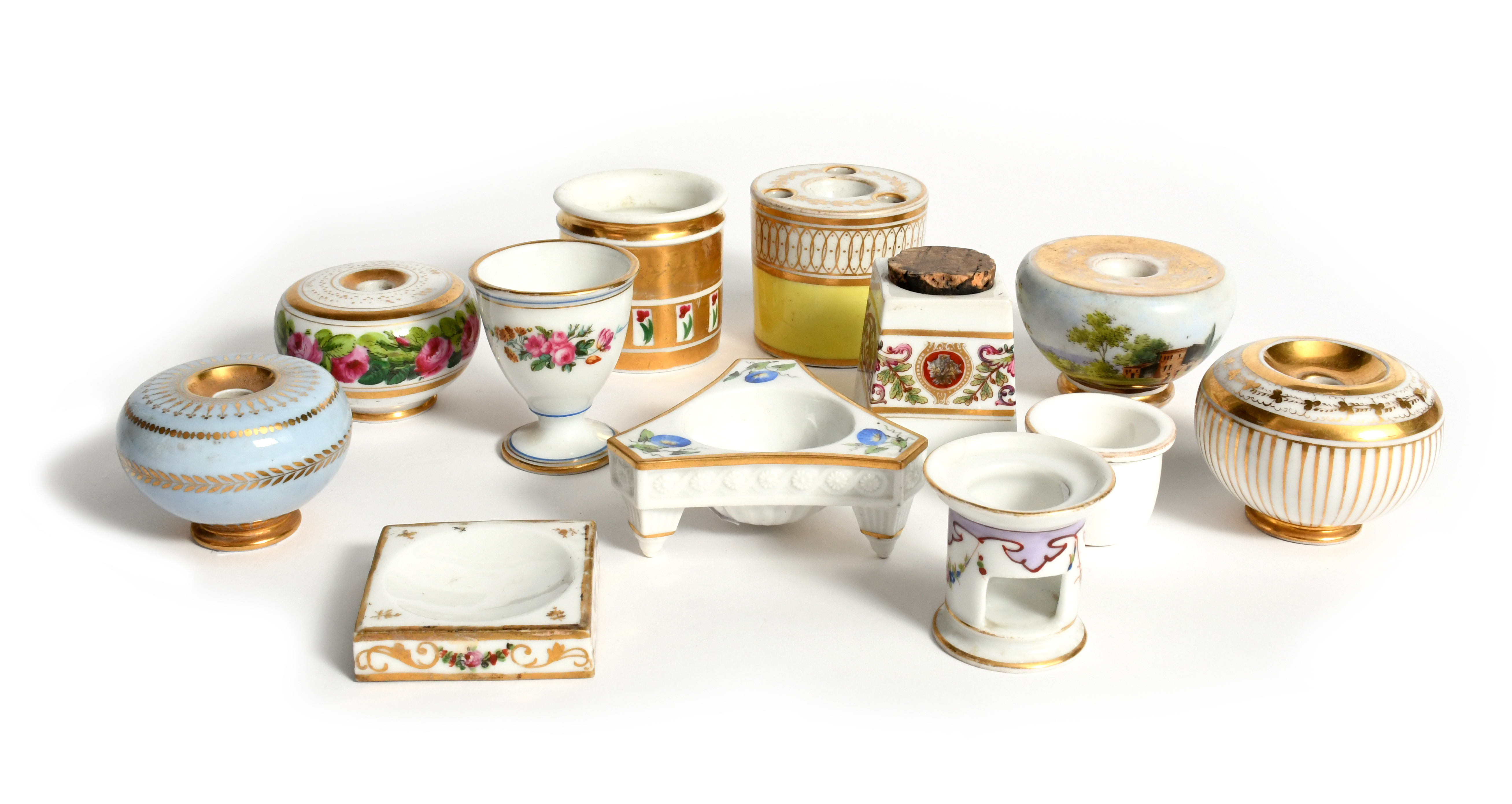Six porcelain inkwells (Paris and English) 19th century, variously decorated with flowers, a