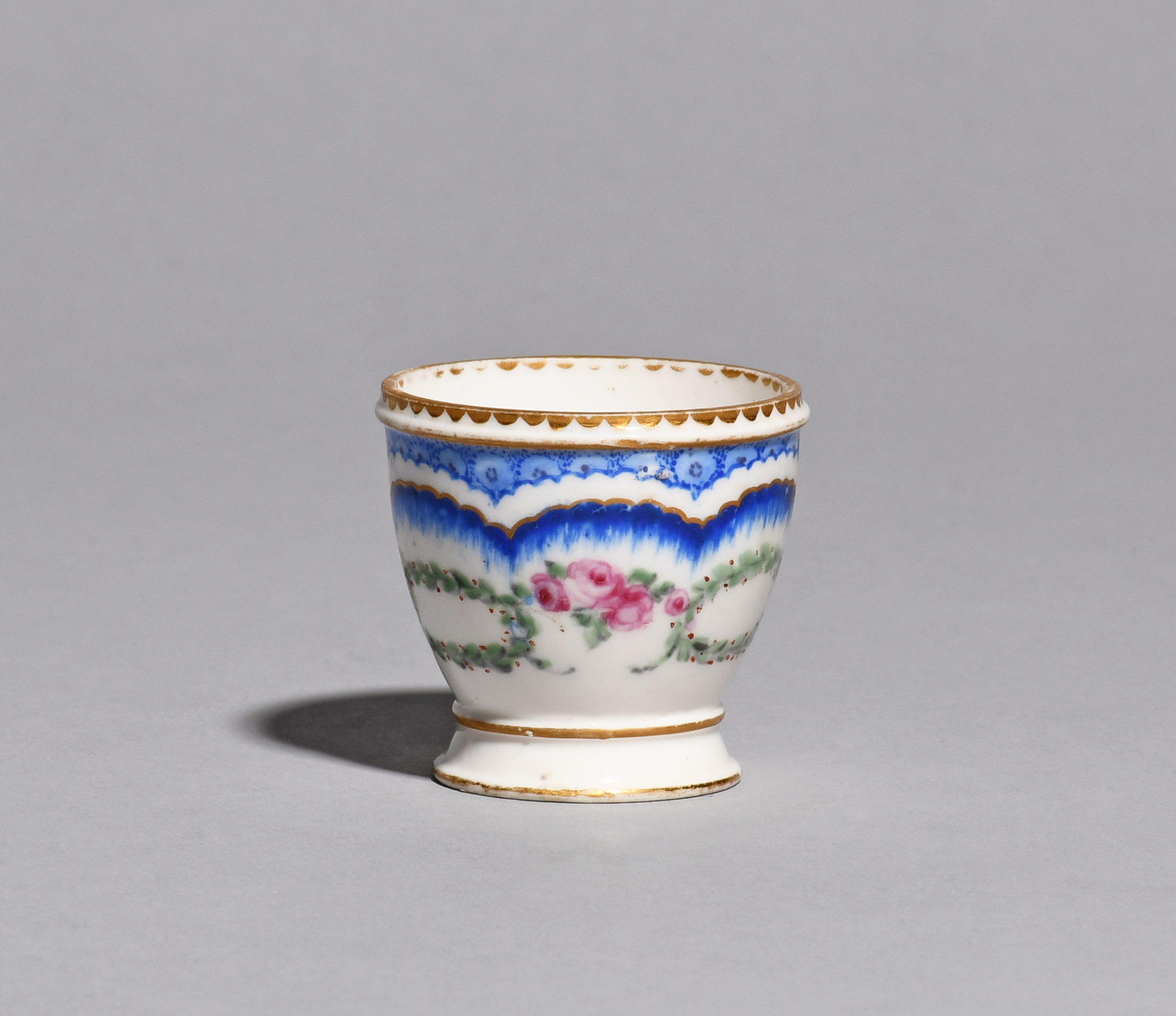 A Sèvres egg cup (coquetier) c.1770-80, the small rounded shape painted by Jean-Charles Sioux l'aine - Image 2 of 2