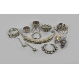 Six Yemen bracelets silver coloured metal, one hung with bells, one hung with heart shape pendants