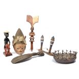 A Yoruba Shango wand Nigeria with a standing figure with a drum and having a thunder axe crest and a