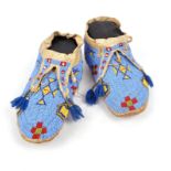 A pair of Lakota moccasins Plains hide with light and dark blue, red, white, yellow and green