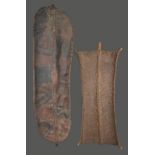 A Turkana shield Kenya rhinoceros or hippopotamus hide with a woven bound wood pole and handle, 85cm