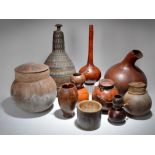 Seven gourds Ethiopia and Burkina Faso including two double gourds with incised decoration and fibre