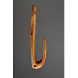 λA Thule fish hook Alaska, circa 1800 walrus ivory, with a curved barbed point, a pierced hole to