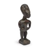 A Yombe standing figure Democratic Republic of the Congo bronze, with incised pupils and the hands