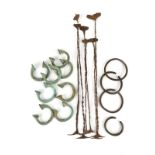 Six Kissi pennies currency Guinea iron, the longest 39.5cm, four Zulu copper alloy bracelets and