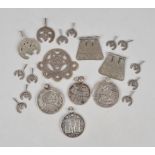 Thirteen Libyan hilal pendants silver coloured metal with pierced and engraved decoration, some with