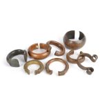 Eight African currency bangles bronze, brass and copper, including Yoruba with flattened ends having