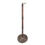 A Zulu beer skimmer South Africa with a pierced tin bowl and a knopped wood handle, 38cm long.