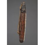 An Aboriginal knife Australia wood with inset possum teeth to one side, with a gum and a fibre