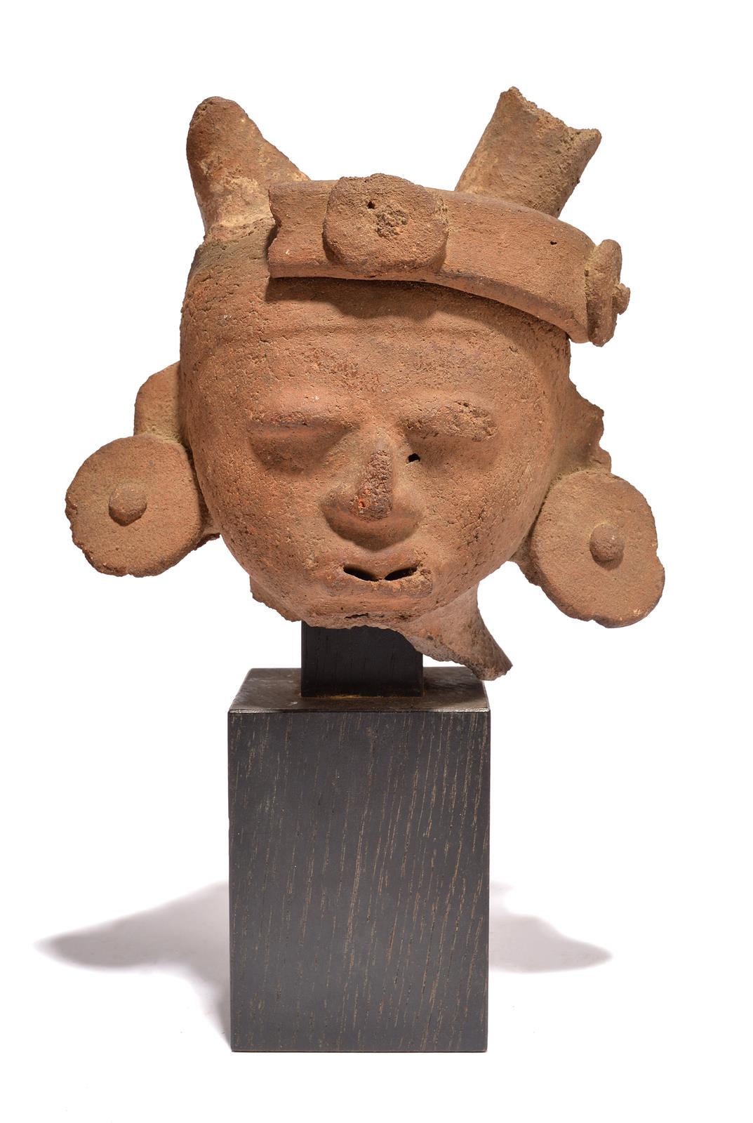 A Veracruz head Mexico, circa 500 - 700 AD earthenware, with the remains of a headband and with