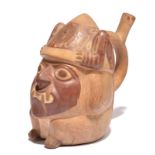 A Moche stirrup vessel Peru, circa 100 - 600 AD pottery, modelled as Ai Apaec with feline teeth