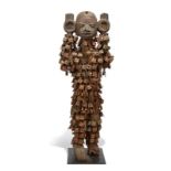 A Nagu guardian figure Benin / Nigeria standing with sheet copper to the face and with remains of