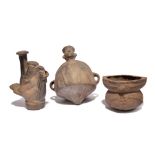 An Inca figure vessel Peru pottery, with a pointed base and a pair of open handles, 22cm high, a