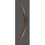 An Aboriginal boomerang Darling River, South East Australia with carved parallel linear and