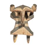 An Izzi elephant mask Nigeria with two carved heads and with black, white and red pigment, 41cm