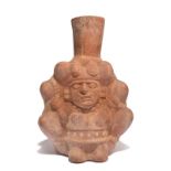A Moche vessel Peru, circa 100 - 600 AD pottery, modelled as Ai Apaec with feline teeth and