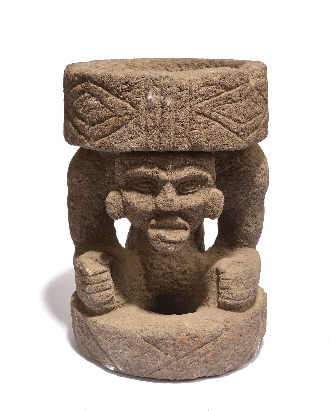 A Costa Rica caryatid metate volcanic stone, with a shallow recess having lozenge and linear